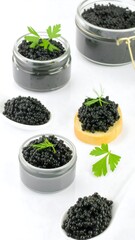 Gourmet black caviar in glass jars and spoons