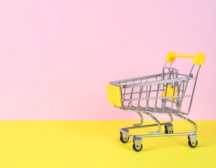 Miniature shopping cart on a pink and yellow background
