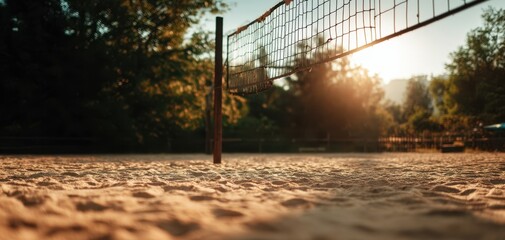 The volleyball net standing tall against a beautiful sunset backdrop.