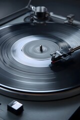 Spinning black vinyl record under low light.