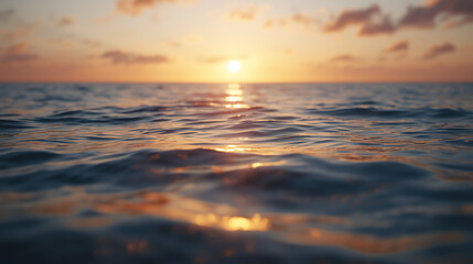 Fototapeta premium A cinematic, ultra-realistic seascape of the ocean at sunset with golden light reflecting on gentle waves. Warm colors, natural light, and tranquil motion create a peaceful and emotional atmosphere.