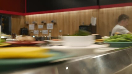 Time Lapse of Conveyor Belt Food Service at Japanese Shabu Shabu Restaurant - Fast Motion Dining Experience.