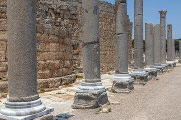 Columns and ruins of buildings in the ancient city of Perge in Turkey. An ancient city founded...