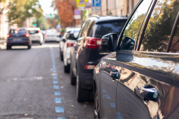 Row of parked cars on a street. Selective focus