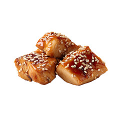 Three glistening teriyaki chicken cubes, coated in sesame seeds, isolated on black