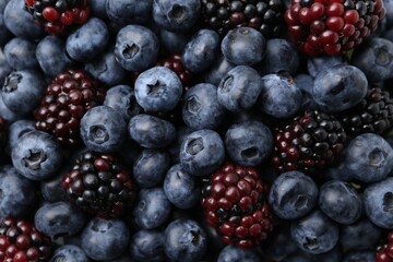 Different ripe juicy berries as background, closeup