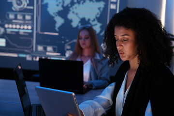 team of executives and partners working together to develop a data management system, business intelligence, data statistics, and marketing analysis behind a slide on a screen.