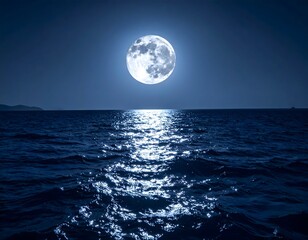 Full moon over a dark, rippled ocean at night