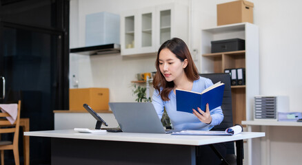 lifestyle of office workers, Woman calculating expenses and using laptop. Home office. Work place....
