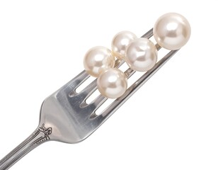 Pearls on a fork against white background (1)