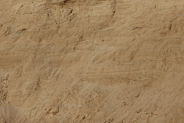 The texture of a sandy mountain with gyrus and structured spots.