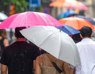 People walking in the rain, umbrellas