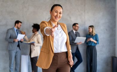Happy office staff, success employee giving hand for shaking. Business people offering handshake