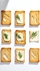 Nine squares of toasted bread topped with cheese and dill