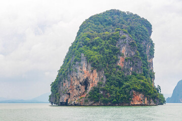 Limestone rocks hills turquoise green water Phang Nga Bay Thailand.