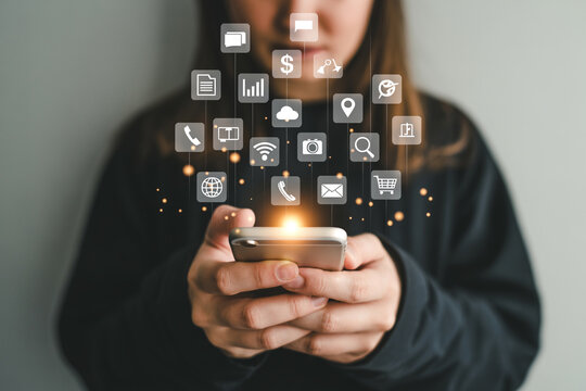 Mobile apps and social media marketing concept woman using smartphone with application icons overlay 100