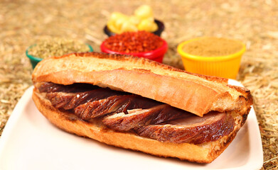 a fried kokorech sandwich