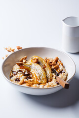 Oatmeal with banana, chocolate chips and nuts.