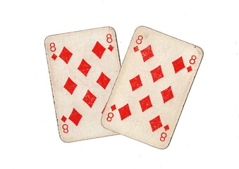 A pair of  identical vintage playing cards isolated on a white background.