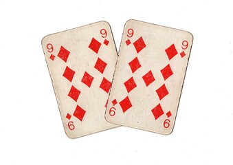 A pair of  identical vintage playing cards isolated on a white background.
