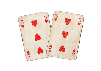 A pair of  identical vintage playing cards isolated on a white background.