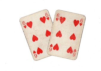 A pair of  identical vintage playing cards isolated on a white background.