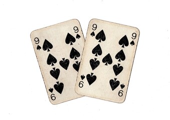 A pair of  identical vintage playing cards isolated on a white background.