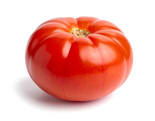 Single, ripe tomato on white background