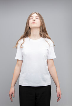 Studio portrait of teenage girl wearing a t-shirt.