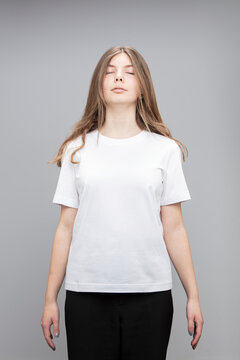 Studio portrait of teenage girl wearing a t-shirt.