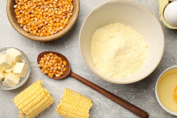 Cornbread preparation. Different ingredients on light grey table, flat lay