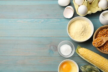 Cornbread preparation. Different ingredients on light blue wooden table, flat lay. Space for text