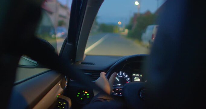 A suspenseful night drive unfolds as a man navigates dark streets with flashing police lights. Tension builds as he tries to evade the law