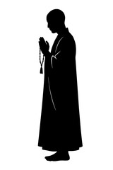 Silhouette monk praying with rosary beads spiritual meditation concept