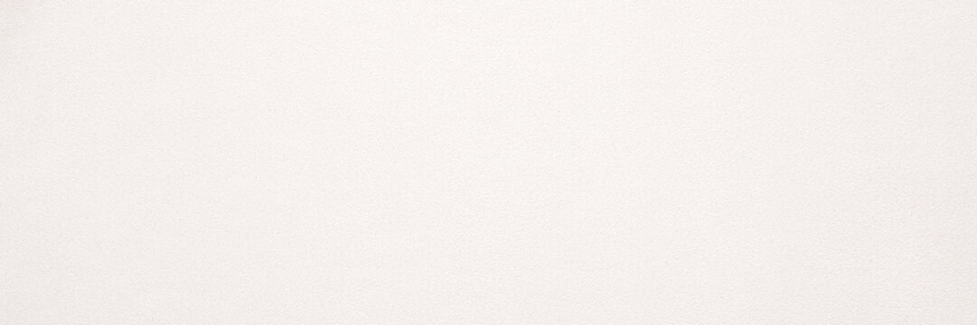 Light beige soft suede fabric background. Closeup. Wide banner. Empty place for text. Top down view.