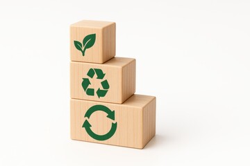Wooden blocks with eco-friendly symbols representing sustainability and environmental awareness