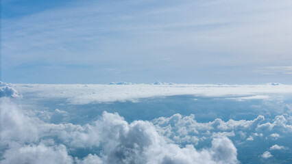 Aerial of Village in rain cloud cover tropical green mountain. Rainy season. Misty cover green forest. beautiful green village