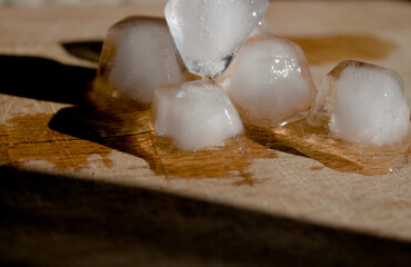 Ice cubes on wooden background
