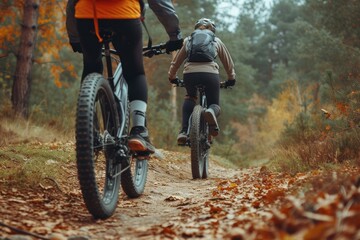 Mountain biking women and man riding on bikes landscape outdoors bicycle.