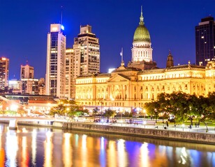 City skyline at night by a river