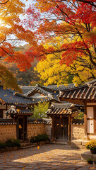 Obraz premium Autumn Scenery Capturing Traditional Korean Village Architecture with Vibrant Foliage