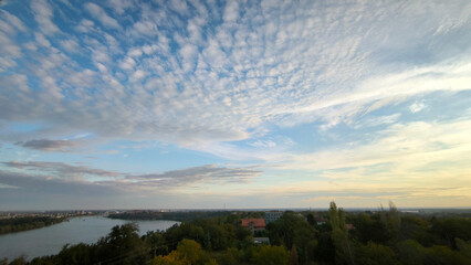 landscape by the Danube river in Novi Sad in autumn, with beautiful small white clouds