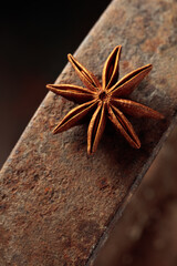 Anise on a rusty background.