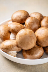 Close-up of fresh brown mushrooms in a bowl