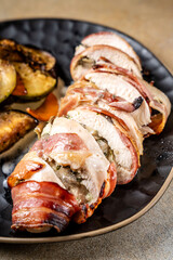 Stuffed chicken breast wrapped in bacon