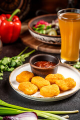 Crispy chicken nuggets with dipping sauce