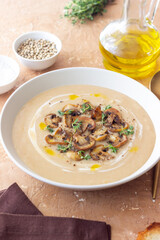 Mushroom cream soup with champignons and thyme. Healthy diet. Vegetarian food.