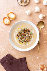 Mushroom cream soup with champignons and thyme. Healthy diet. Vegetarian food.