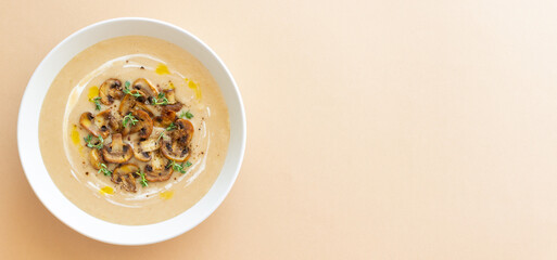 Mushroom cream soup with champignons and thyme. Healthy diet. Vegetarian food.