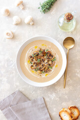 Mushroom cream soup with champignons and thyme. Healthy diet. Vegetarian food.